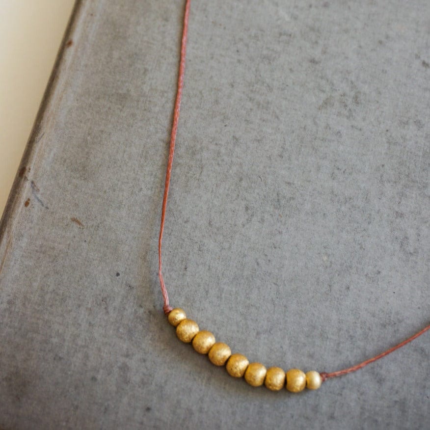 River Song Jewelry Golden Beaded Necklace on Taupe Thread