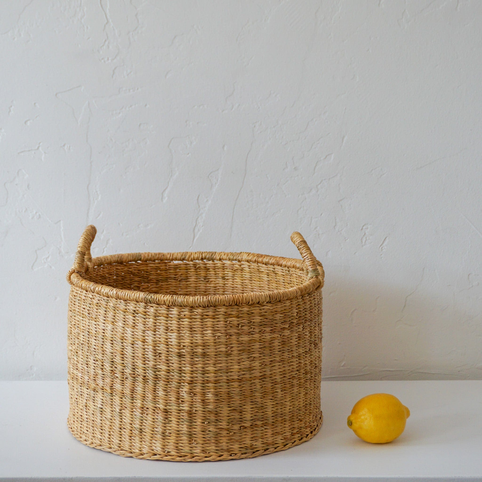 Woven Worldwide Baskets Medium Woven Flat Bottom Basket  w/ Handles